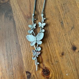 Silver butterfly necklace, unique and off brand.